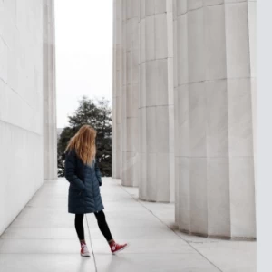 Woman walking inside a Washington DC building.