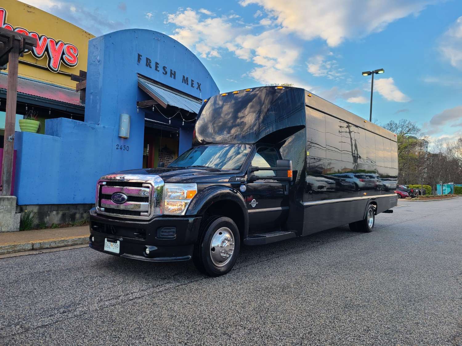 Group transportation arriving at Point Park for Love Groove Festival 2026 in Baltimore