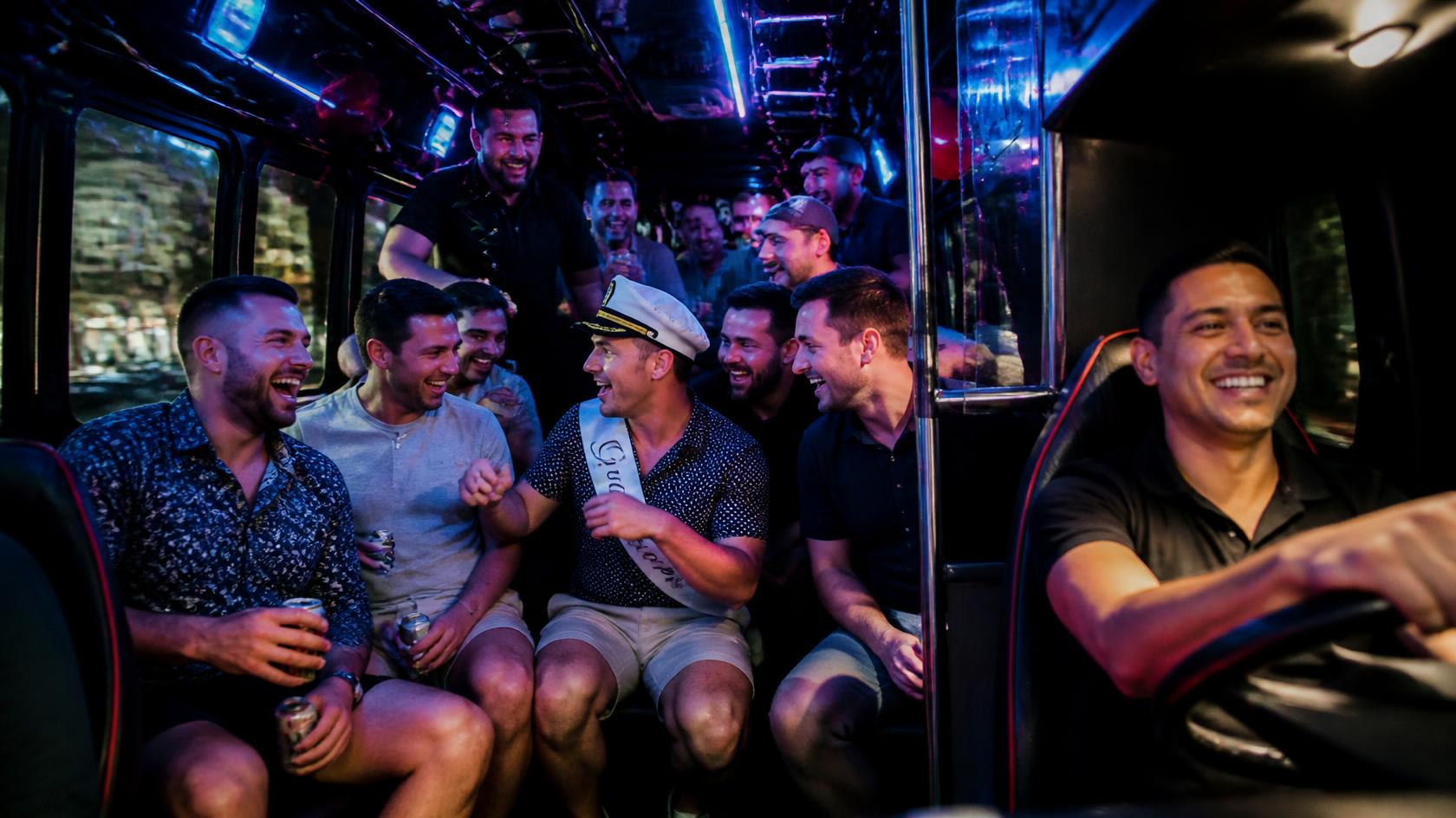 Bachelorette party group celebrating on a party bus with a chauffeur