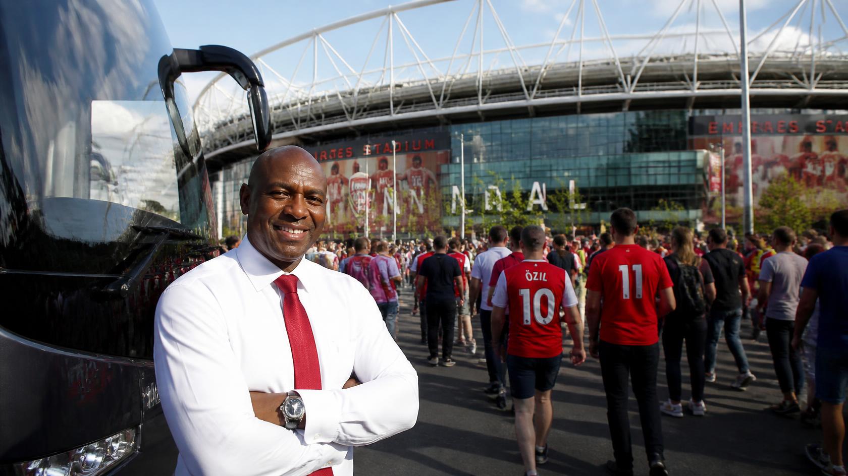 Chauffeur and vehicle outside a stadium for a Commanders game drop-off and pickup
