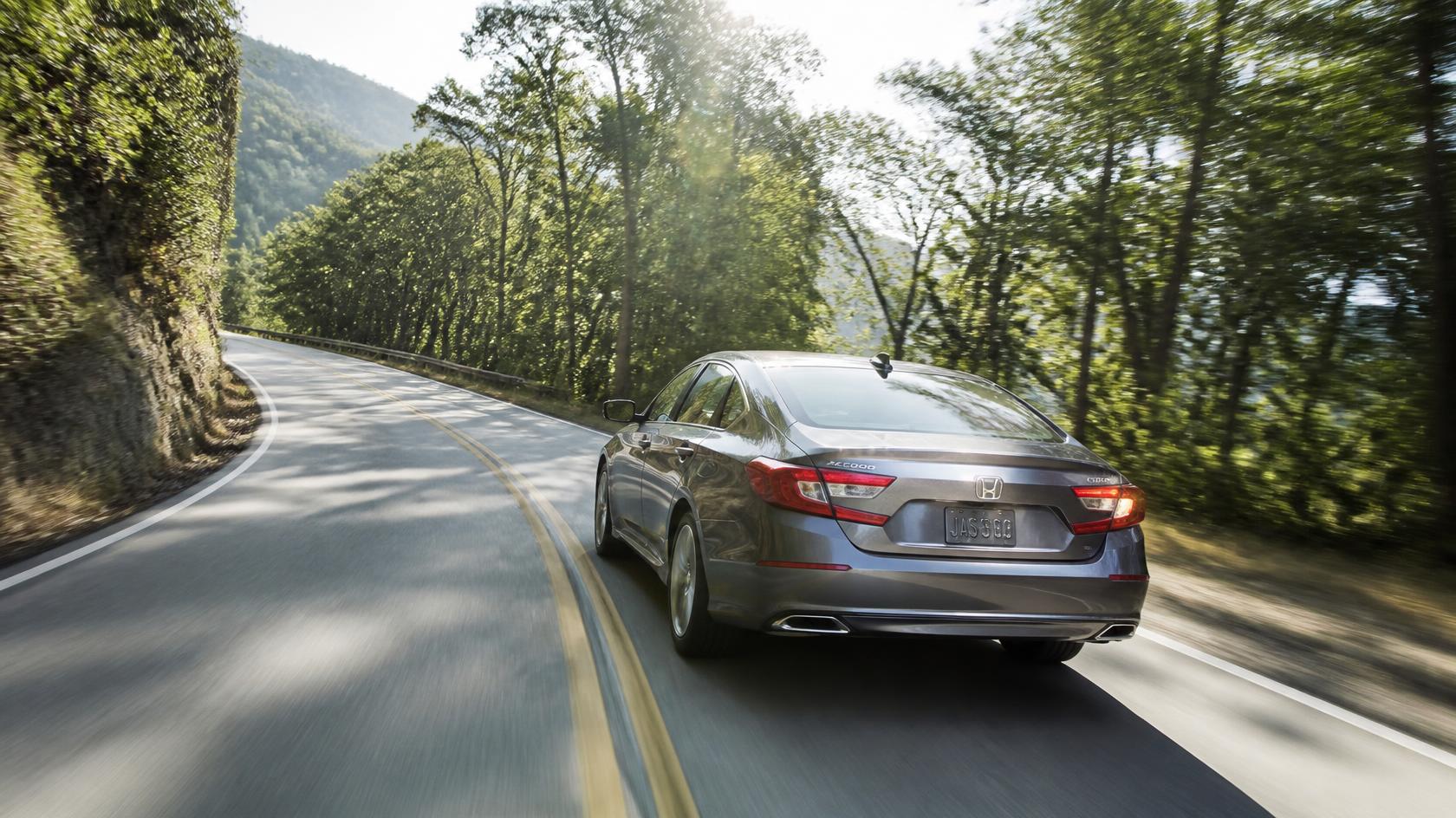 Sedan on the winding approach to Gramercy Mansion in Stevenson, Maryland