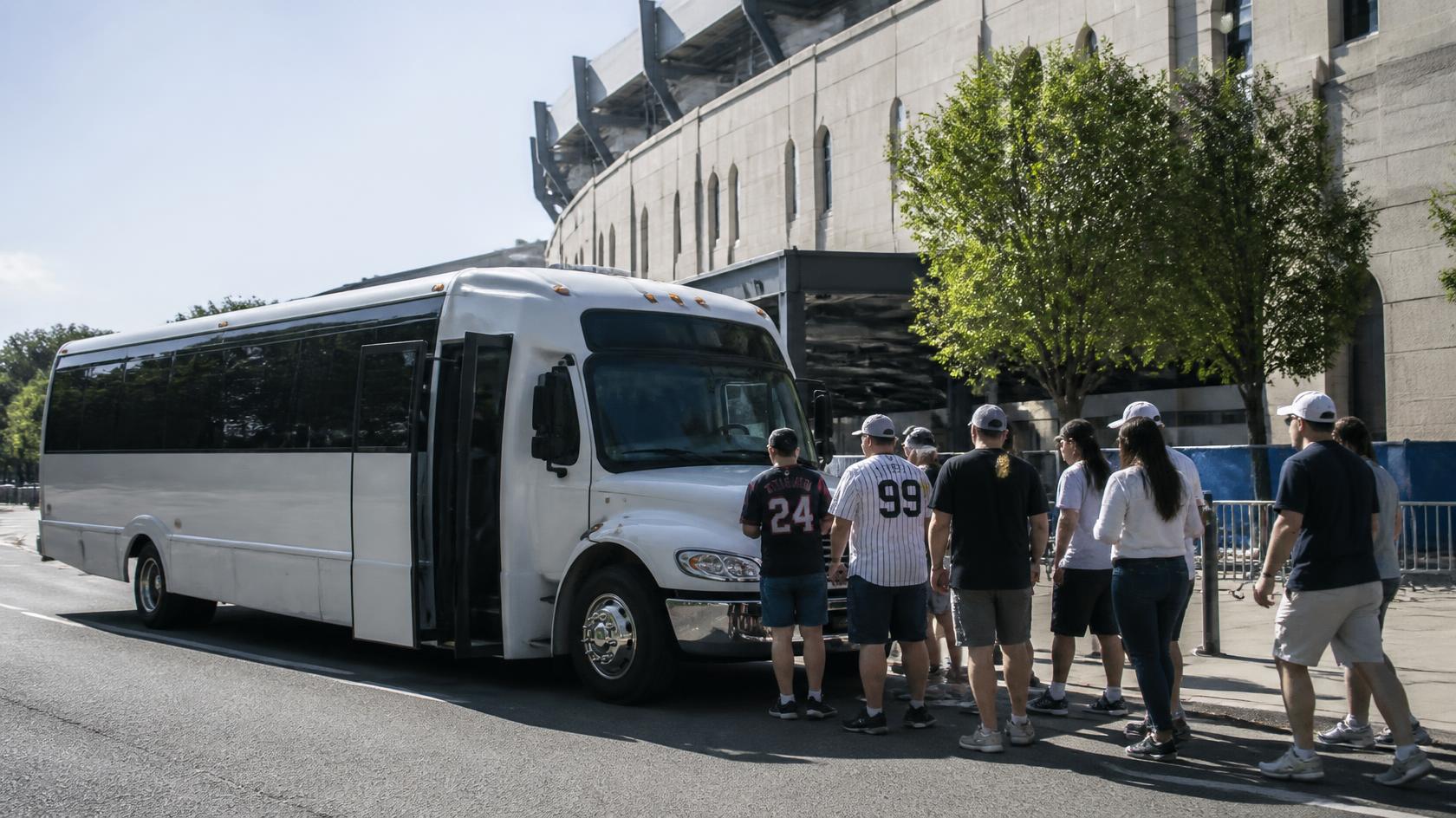 Group of Navy football fans arriving together by shuttle for a game in Annapolis