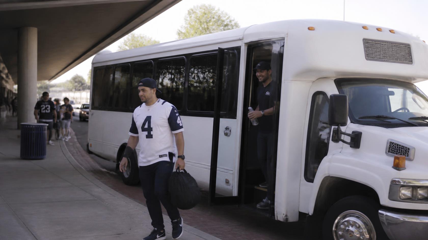 Navy football fans riding together in a Bayside Limousines shuttle to Navy-Marine Corps Memorial Stadium in Annapolis